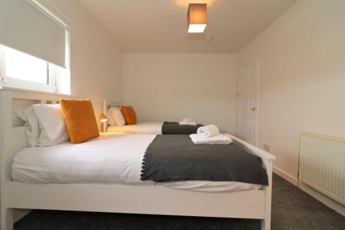 Katil atau katil-katil dalam bilik di Signature - Belhaven House