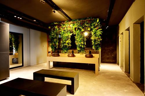 a room with a wall with plants on it at Jasmin Elite Residence & SPA in Gümbet