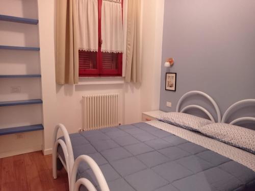 Ένα ή περισσότερα κρεβάτια σε δωμάτιο στο Casa degli Ulivi