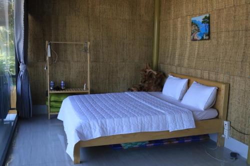 Postel nebo postele na pokoji v ubytování Hành Ngò Homestay - Hòn Đỏ Ninh Thuận