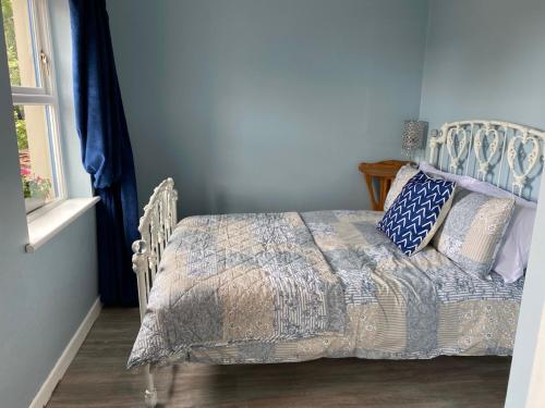 Postel nebo postele na pokoji v ubytování Blueberry Tiny Home