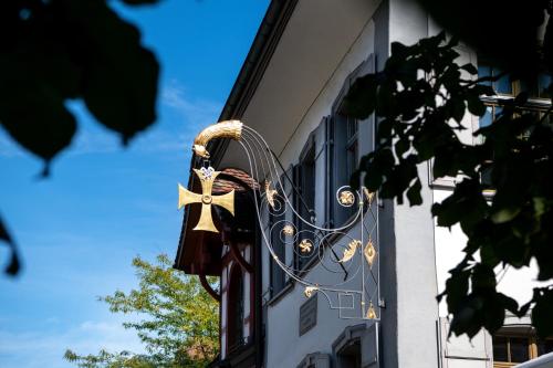 a door of a building with a bow on it at Hotel zum goldenen Kreuz in Frauenfeld
