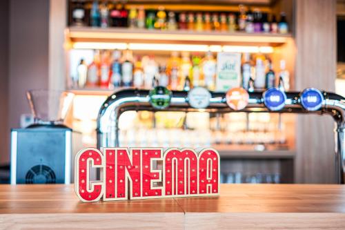 a bar sign sitting on top of a table at ibis Styles Lens Centre Gare in Lens