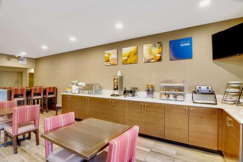 a kitchen with a table and a dining room at Comfort Inn Airport in Roanoke