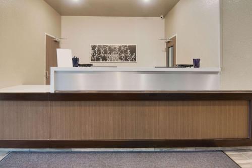 a waiting room with a reception counter in a building at Sleep Inn Dallas Northwest - Irving in Dallas