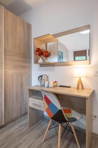 a home office with a desk and a chair at Tarnovgrad Apartments - Free parking in Veliko Tŭrnovo