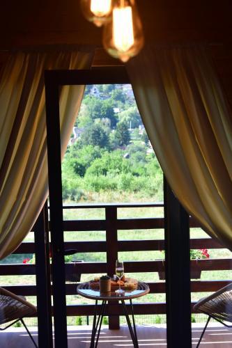 a view of a room with a table and a window at Vila Grujic in Vrdnik