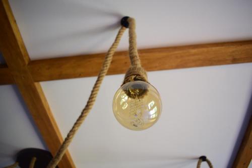 a glass ball on a rope hanging from a ceiling at Vila Grujic in Vrdnik