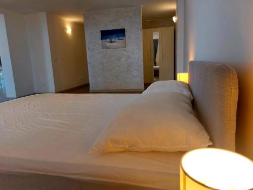 a bedroom with a bed with two pillows on it at JAZZ STYLE - On The Beach - Anzio in Anzio
