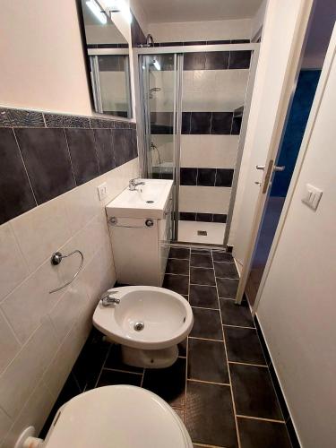 a small bathroom with a toilet and a sink at JAZZ STYLE - On The Beach - Anzio in Anzio