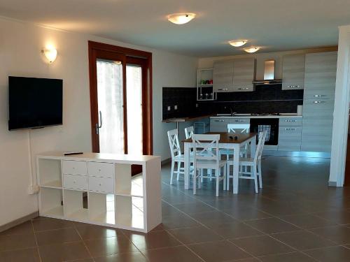 a kitchen and dining room with a table and chairs at JAZZ STYLE - On The Beach - Anzio in Anzio
