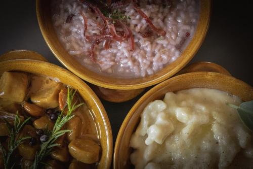 four bowls of different types of food on a table at Agriturismo la campagnola in Gordona
