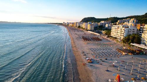 an aerial view of a beach with a crowd of people at Hotel Andi in Durrës