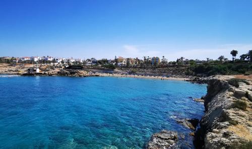 a view of a beach with blue water at GREAT VILLA MARIA in Paralimni