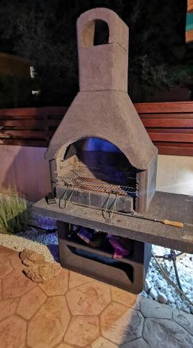 a stone oven with a fire inside of it at GREAT VILLA MARIA in Paralimni