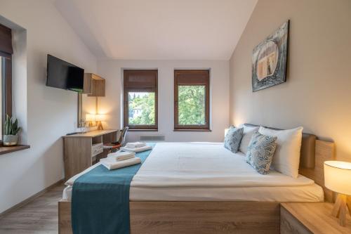 Postel nebo postele na pokoji v ubytování Tarnovgrad Apartments - Free parking