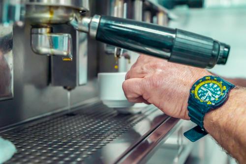 a man holding a coffee machine with his hand at Hotel Tropical in Puerto de la Cruz
