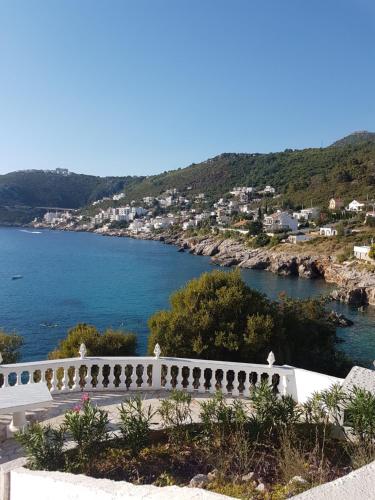 a view of the ocean from a house at Apartman Haris in Dobra Voda