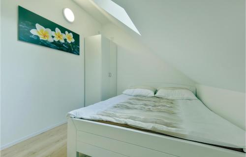 a white bedroom with a bed in a room at Lovely Home In Tuhelj With Sauna in Tuhelj