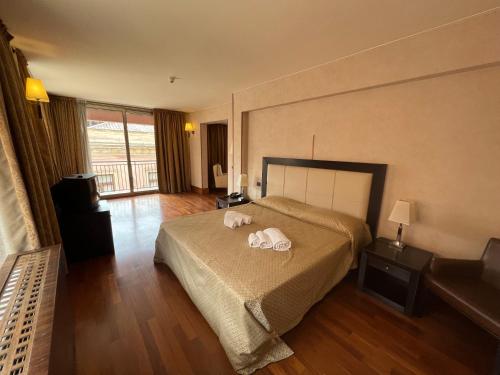 Ένα ή περισσότερα κρεβάτια σε δωμάτιο στο Hotel La Fenice