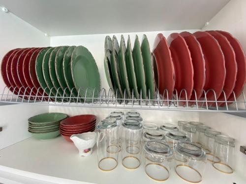 a shelf with plates and bowls in a refrigerator at Exclusive Villa Larnaca - 8 plus sleeps - 2 min from BEACH - Big Private Pool in Pyla