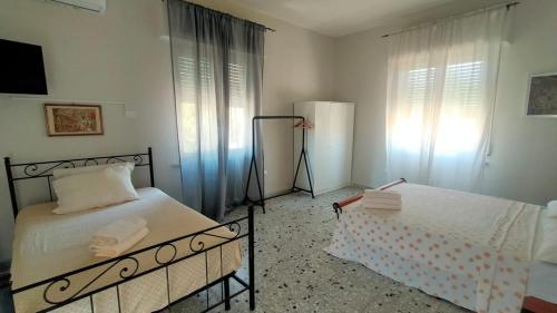 Posteľ alebo postele v izbe v ubytovaní Le Stanze di Ginevra 1-Caserta-