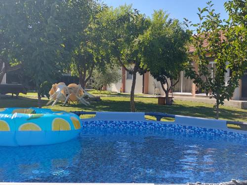 a water park with an inflatable pool and a water slide at Apartment Helena Airport in Podgorica