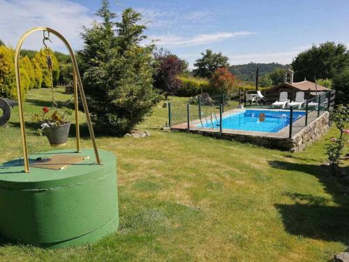 a swimming pool in a yard next to afficientfficientfficientfficientfficient at Alcázar Milmanda in Milmanda