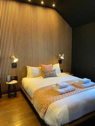 a bedroom with a bed with two pillows on it at The Fort York in York