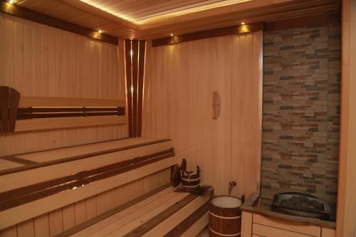 a sauna with a window and a brick wall at Termez Palace Hotel & Spa in Termiz
