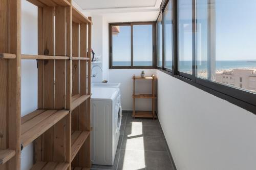 a bathroom with a view of the ocean at AG Aquarium in Playa de Gandia
