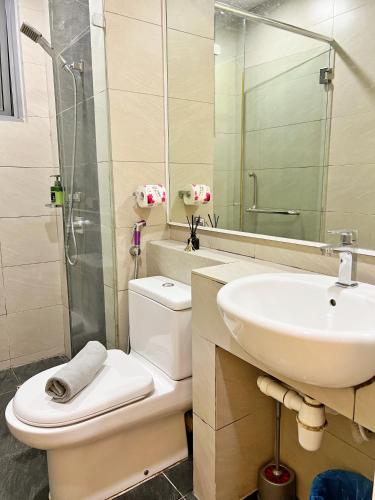 a bathroom with a toilet and a sink at Maison life 小居屋 The Loft Imago in Kota Kinabalu