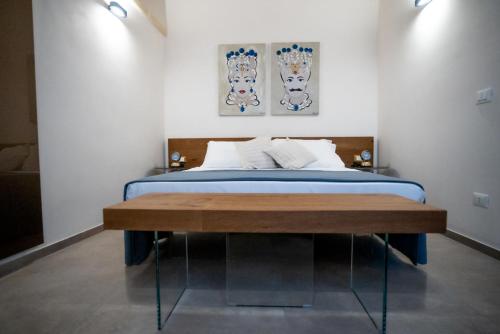 A bed or beds in a room at Setteminne Resort Design