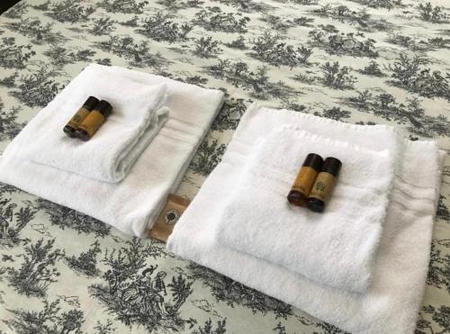 two towels sitting on top of a bed at Trastevere room in Rome