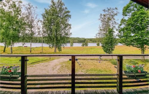 a view of a park from a porch at Awesome Apartment In Färgelanda in Färgelanda
