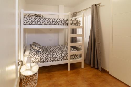 A bed or beds in a room at Risco Verde Paradise
