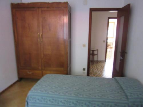 Ένα ή περισσότερα κρεβάτια σε δωμάτιο στο Garaventa Angelo Apartments