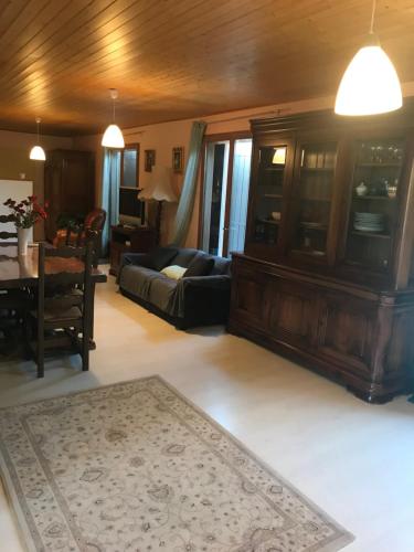 a living room with a couch and a table at Studio privé in Cazilhac