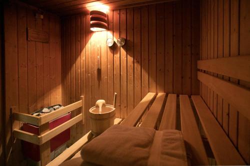 a room with a bed in a wooden cabin at Mariaweiler Hof in Düren - Eifel