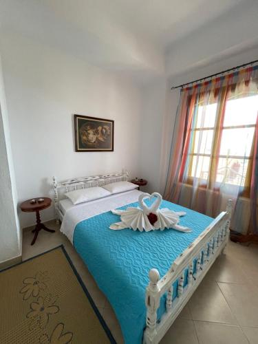 Säng eller sängar i ett rum på Ioannis (Family House)