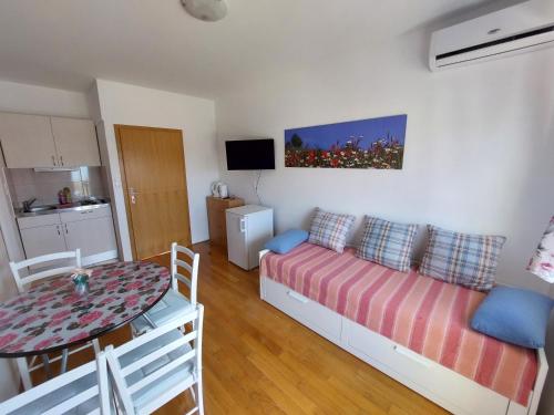 Postel nebo postele na pokoji v ubytování Apartments Crnjac