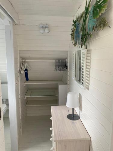 a home office with a table and a lamp at Seehütte Neusiedlersee - Waterfront 2 in Rust