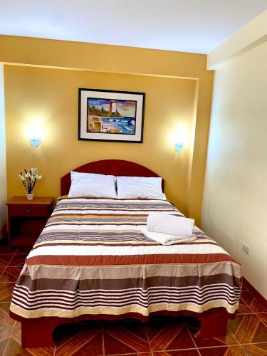 Postel nebo postele na pokoji v ubytování Samay's Hostal