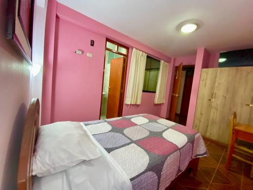 Postel nebo postele na pokoji v ubytování Samay's Hostal