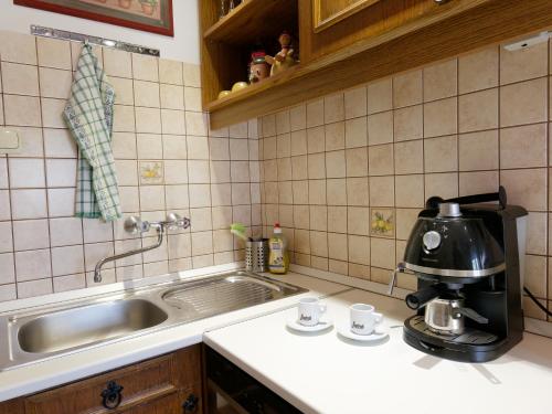 A kitchen or kitchenette at Family Buda Apartment