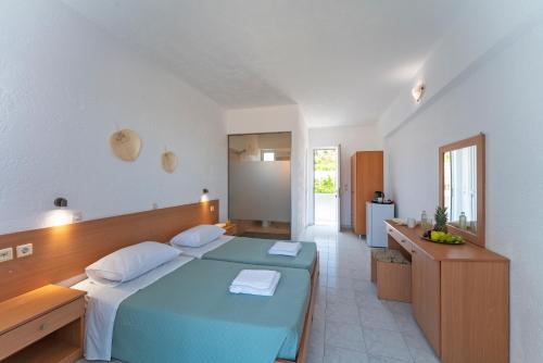 Posteľ alebo postele v izbe v ubytovaní Yiasemi Faliraki Rooms