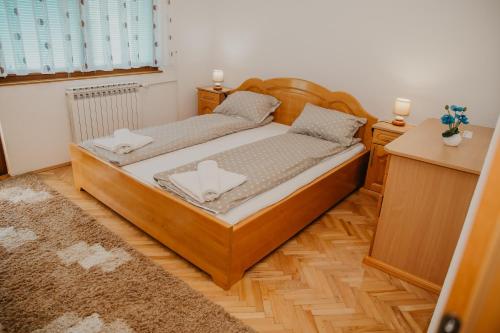 a bedroom with two twin beds in a room at Guest House Ahmo Halilcevic in Dubrave Gornje