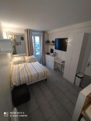 Cama o camas de una habitación en Studio à Montmartre