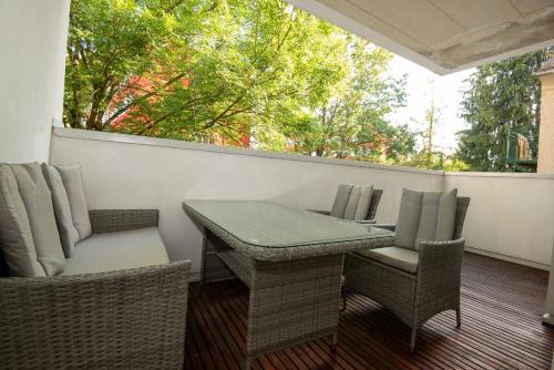 a table and chairs sitting on a patio at Appartements in Graz beim LKH in Graz