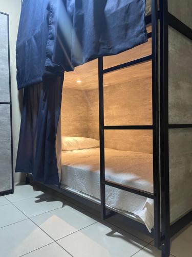 Ein Bett oder Betten in einem Zimmer der Unterkunft HOSTAL XAO